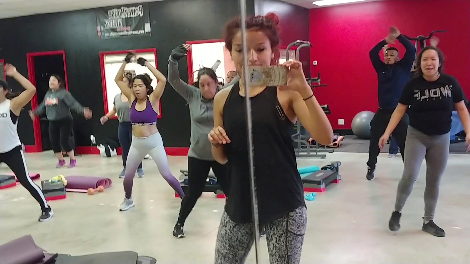 Members moving together during a cardio class